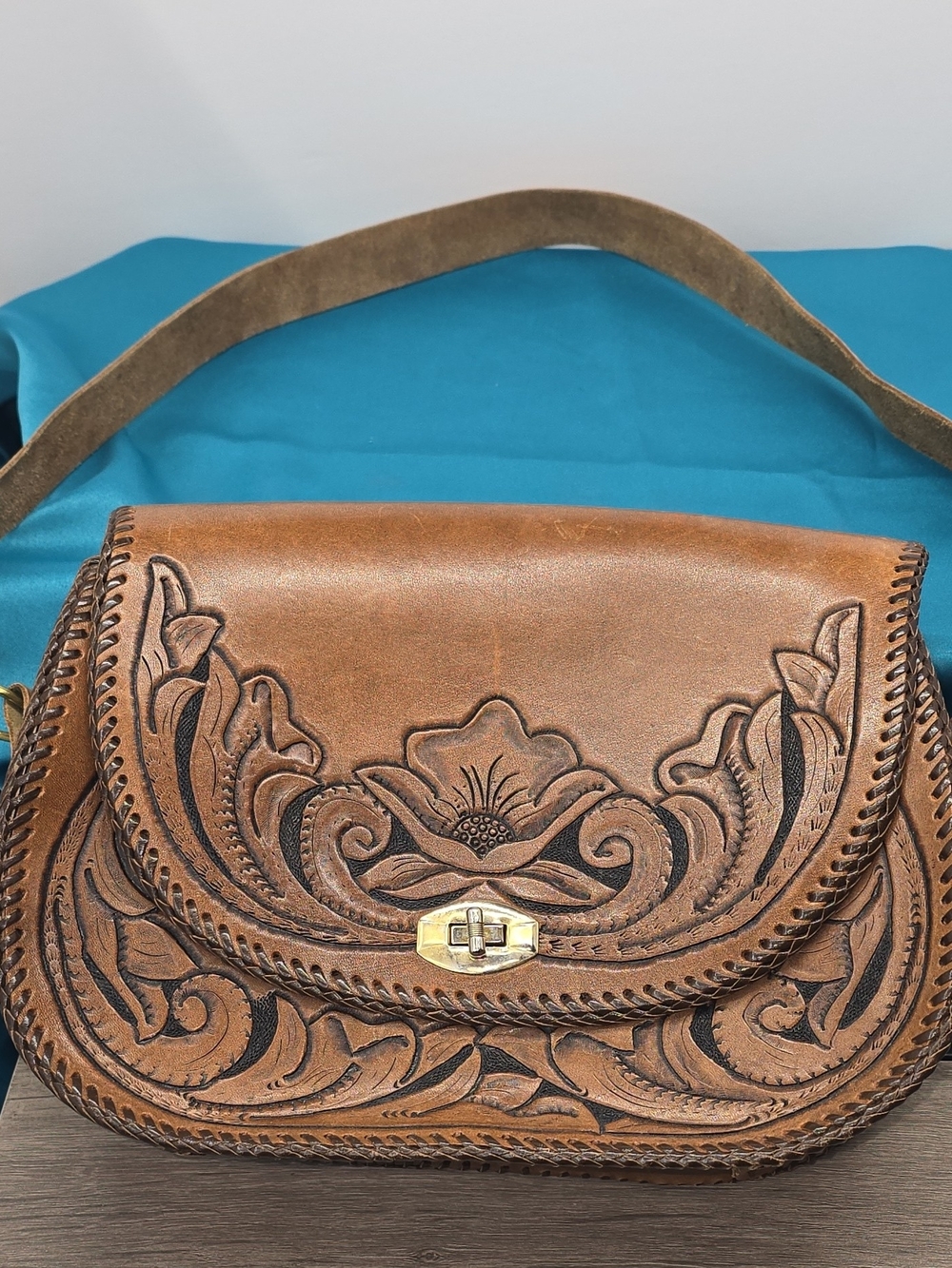 Hand-Tooled Brown Leather Crossbody Bag with Floral Design